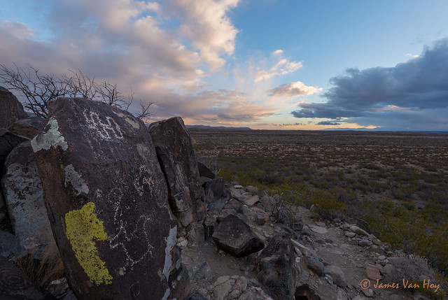Petroglyphs in the stormy sunset