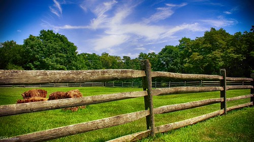 wooden fence with bales of hay by RGL Photography, Allaire State Park is a park located in Wall Township in Monmouth County, New Jersey, United States,