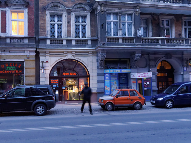 Red Fiat 126p, evening, street in Stettin, December 2012