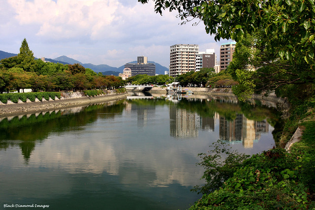 Tranquil Motoyasu River, Hiroshima Peace Memorial Park (left), The Atomic Bomb Dome, A-Bomb Dome or Genbaku Dome (centre) - Hiroshima, Japan