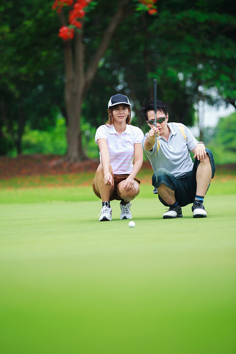 summer vacation people woman man game cute green girl field grass sport club ball golf landscape asian thailand happy person asia play action outdoor background small lawn young lifestyle competition player resort course professional equipment together thai golfing tropical tropic leisure recreation teaching activity putting golfer active caucasian recreational compete