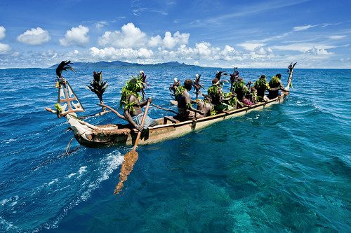 Men from Masahet in a canoe