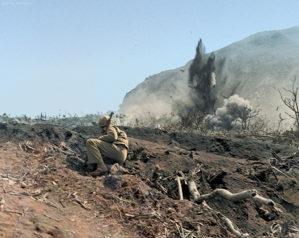 US Marine watches as Japanese forces are shelled on Iwo Jima, ca. Feb-Mar 1945.