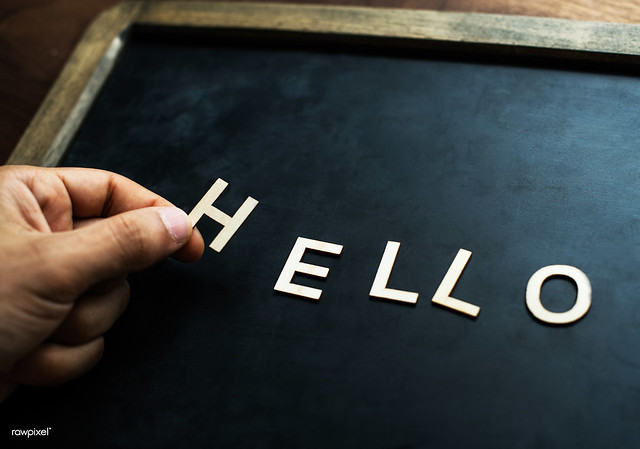 Aerial view of black board with the letter forming hello greeting concept