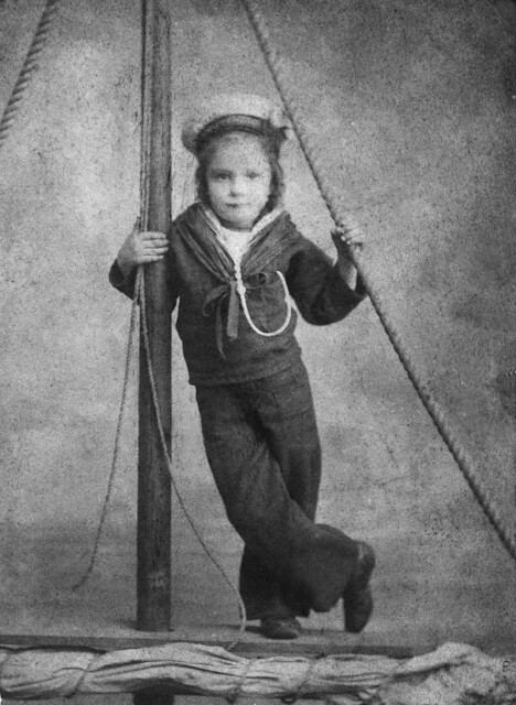 An unknown child dressed as a sailor