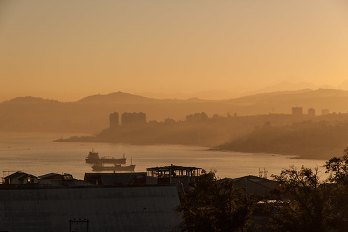 chile city sea sun mountains water silhouette sunrise valparaiso haze cityscape rays sunrays