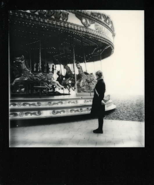 The Woman by the Merry-Go-Round on the Beach in Brighton