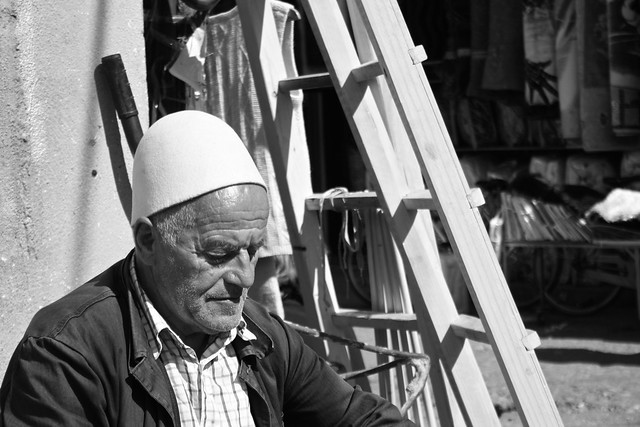 A concentrated working man in Peja/Peć. Kosovo