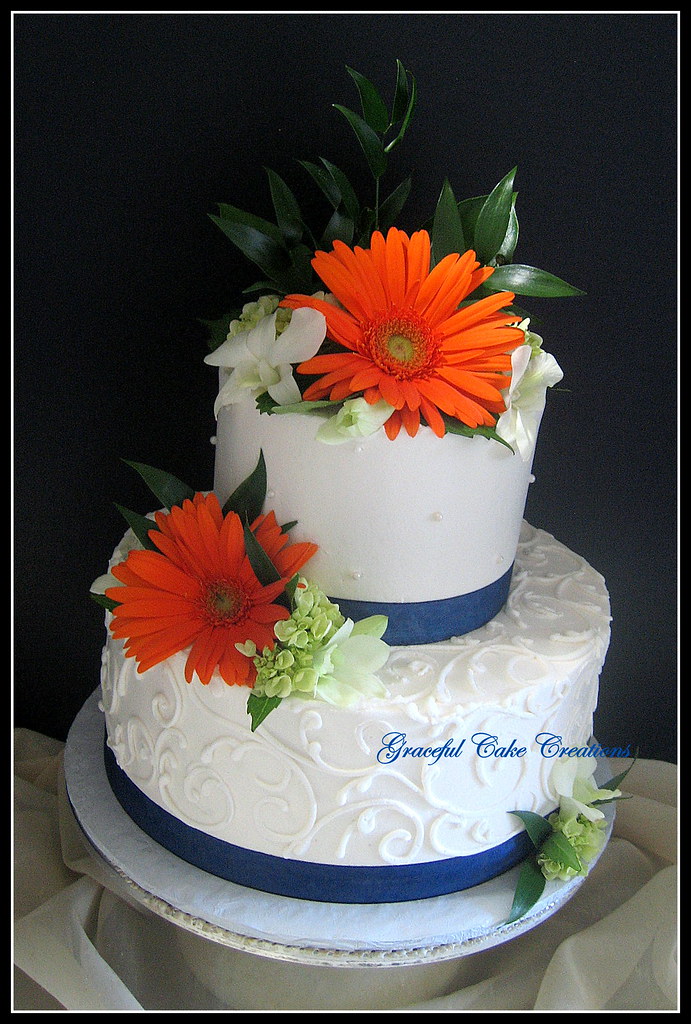 Elegant Ivory Wedding Cake with Orange Gerberas