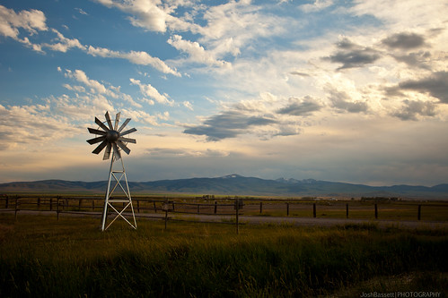 sky mountains west mill windmill grass clouds fence landscape golden big scenery montana mt wind farm hour