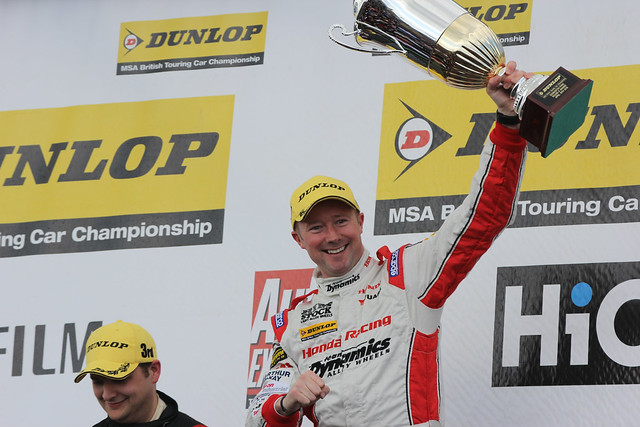 Gordon Sheddon with his trophy after winning at the BTCC race at Donington Park in April 2012