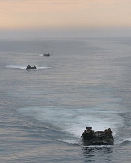 An Amphibious assault vehicles navigate toward the well deck. | by Official U.S. Navy Imagery