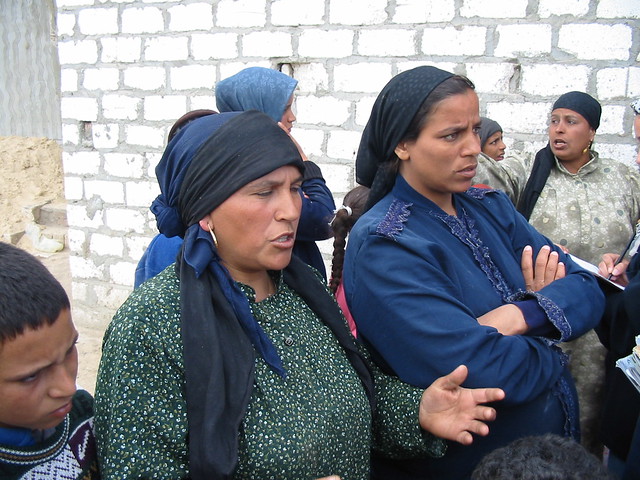 Peasant Women telling rights activists and journalists about police terror against them