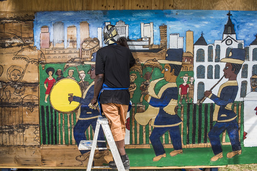 Charles Gillam, Sr. works on a mural during Jazz Fest day 2 on April 28, 2018. Photo by Ryan Hodgson-Rigsbee