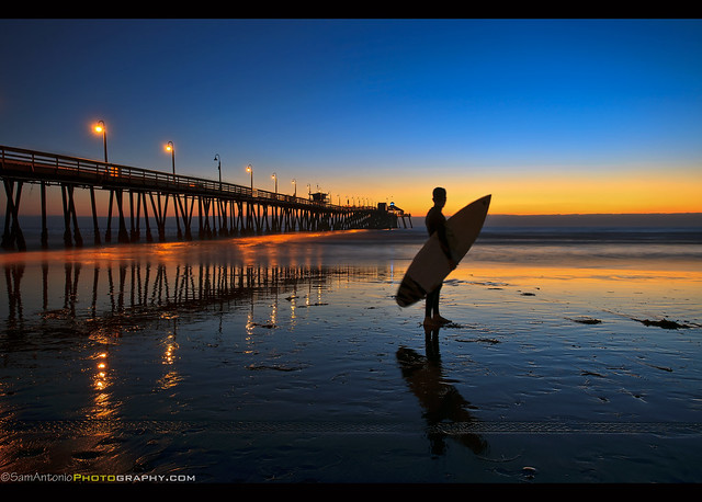 The lone surfer at Imperial Beach Pier