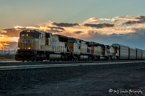UP 4821 | EMD SD70M | UP Laramie Subdivision by M.J. Scanlon, As the sun sets over central Wyoming, a UP auto train (ABAWG) passes eastbound through the little to