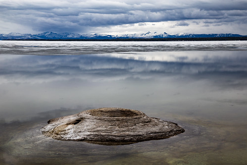 west thumb geyser basin fishing cone spring yellowstone lake national park water clouds mountains snow ice