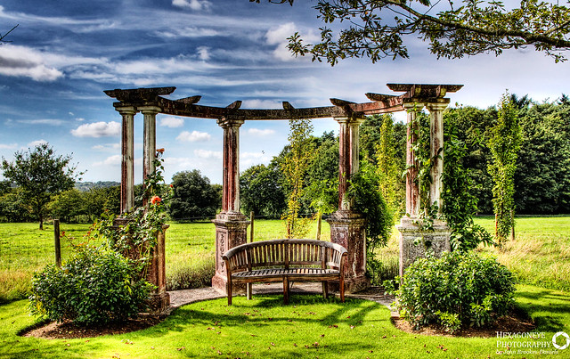 Beautiful Pergola at the bottom of the Garden at Hill Place, Swanmore.

The grandparents of the current custodians are buried under the Pagoda as they wanted to be together in their favourite place.

Hill Place is a grade II listed[ Georgian country villa located near the village of Swanmore in Hampshire, England.
Richard Goodlad built Hill Place in about 1790. It is thought that Sir John Soane was the architect 
In 2011, Hill Place was the subject of a Channel 4 television documentary presented by hotelier Ruth Watson as part of her Country House Rescue series.

Focal Length: 21 mm
ISO Speed: 200
Aperture: f/11
Shutter Speed: 1/400 sec
