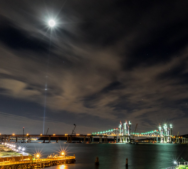 9/11 World Trade Center Tribute in Light appears to be reaching the moon with NYC in distance