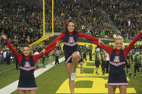 The Arizona Wildcats cheerleaders spelling out the "I love Arizona and dislike the Oregon Ducks" formation at the game in Eugene