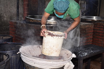 The banana wine making process. Bananas are boiled then sieved to extract the juice