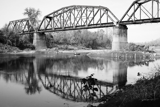 Canoe, Fisherman and  Railroad Bridge over Brazos River, Brookshire, Texas 1212051107BW
