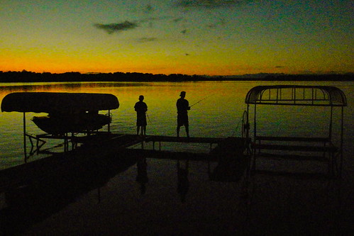 sunset lake alexandria minnesota fishing cabin silhouettes grainy iphone iphonephotography