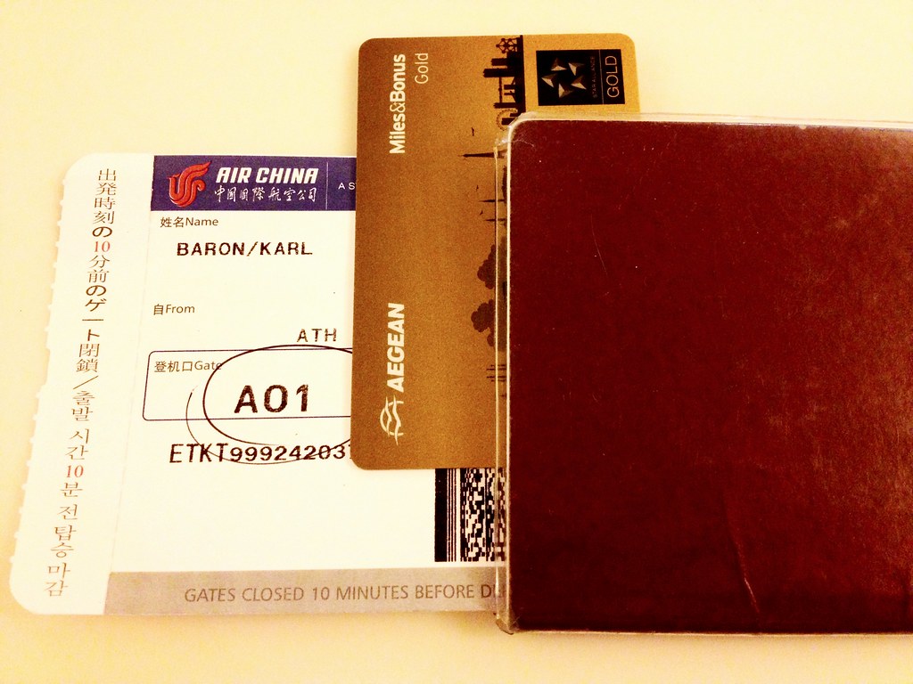 Passport, boarding pass and travel card on a table