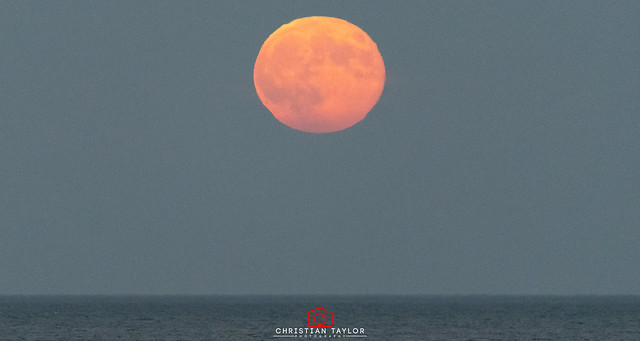 Orange Moon rising at Bournemouth, Dorset