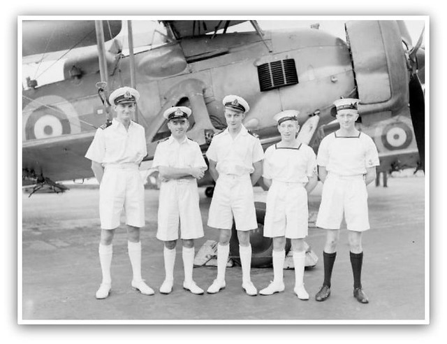 Officers and ratings who were decorated for the part they played in the sinking of the BISMARCK, in front of a Fairey Swordfish aircraft. Left to right: Lieutenant P D Gick, RN, awarded DSC; Lieutenant Commander Eugene Esmonde, RN, awarded DSO; contd