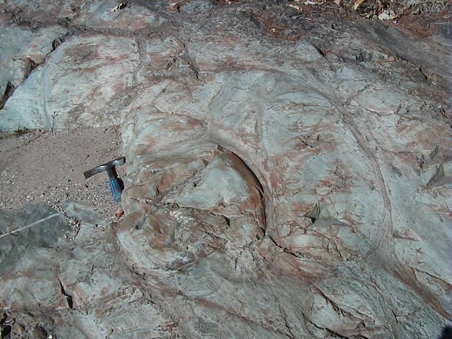Greenstone (metamorphosed pillow basalts) (Mona Formation, Neoarchean, 2.7 Ga; Rt. 41/Rt. 28 roadcut west of Marquette, Michigan, USA) 1