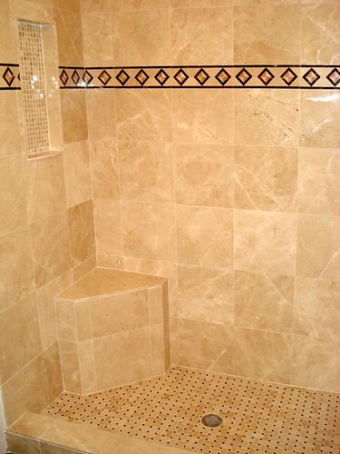 Travertine tile with granite border accents