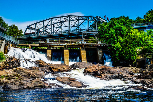 waterfall waterfalls dam bridge bracebridge ontario canada rocks bay river falls landmark landscape serene peaceful trees blue sky lake muskoka cottage country outdoor outdoors harbourfront harbour scenic reflection waterway canal sun leaves photography photo ddbphotograhy ddbphotography sony a77m2 water building arch architecture