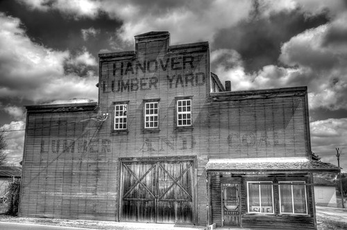 wood blackandwhite bw building clouds facade rural canon town wooden illinois small il business ill fade material fading coal hanover lumber lumberyard photomatix photomatixpro t2i