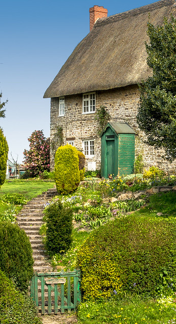 A pretty thatched cottage  in the hamet of Hodson in Wiltshire