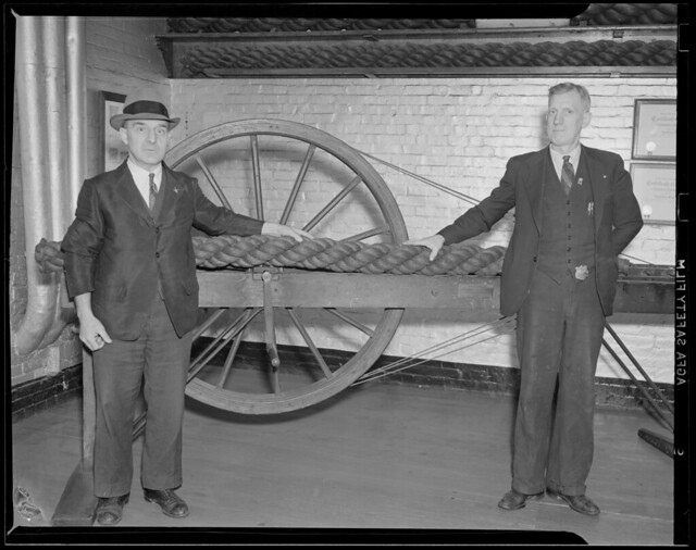 Charlestown Navy Yard/rope making, T.J. Kaes (with hat) foreman of rope making crew and oldest employee at Navy Yard started at age 15 in 1898 working with his hand spinner, has worked for 41 years. F. B. Christensen - quarter man - also started in 1898,