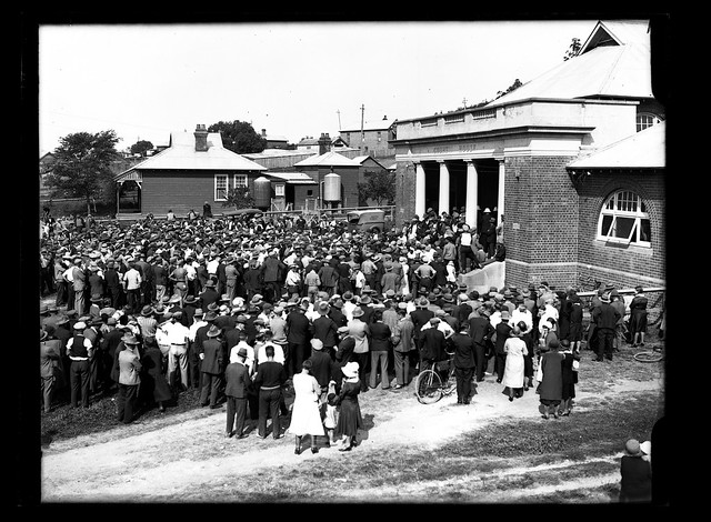An unidentified crowd outside of an unidentified Court House [n.d.]