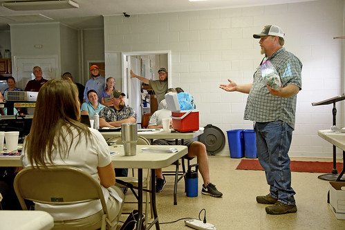 Industrial hemp farmer Calvin Whitfield shares his story with law enforcement officers at the Piedmont Research Station.