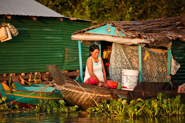 A pregnant woman up early in the floating village of Kompong Phhluk, Cambodia #5