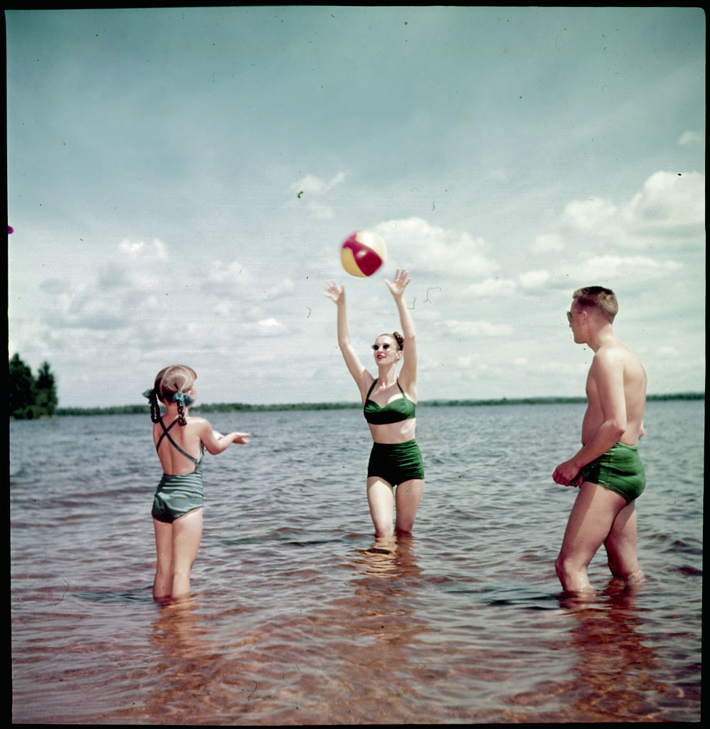 Man, woman and young girl playing with a beach ball in the… - Flickr
