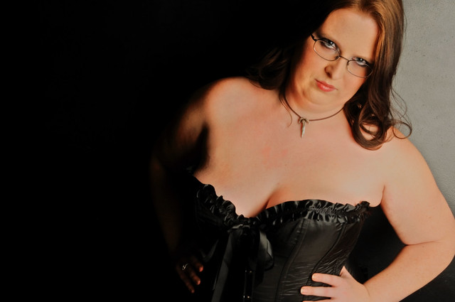 Large Bespectacled Brunette Model in Black Bustier Top : Double Take Studios Shuts Down