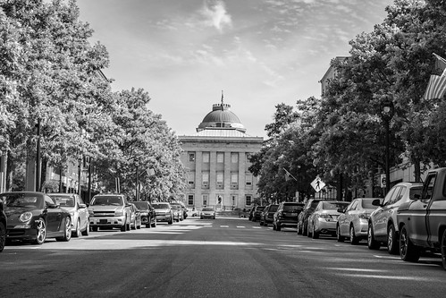north carolina nc state capitol black white bw monochrome trees car street road clouds sky dome window building historic architecture