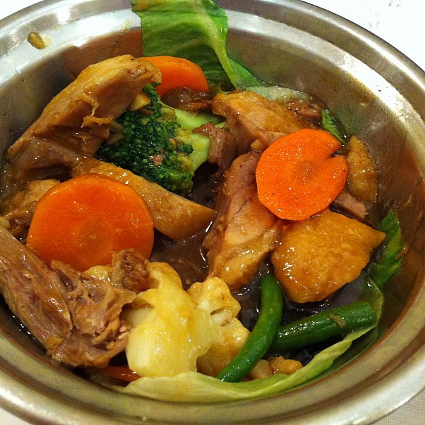 Duck with chinese mushroom hotpot with vegetables (half eaten)