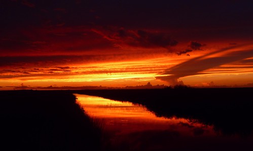 sunset afterglow red glow reflection river cloudscape cloudburst shadow calm serene nature beauty natural hometown florida unitedstates usa floridaeverglades riverofgrass open space colorful dramatic composition reddream summer2016 9616 outdoor sky southflorida broward coralspringsflorida wow
