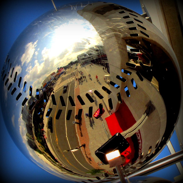 street scene as reflected on a baseball - nationals park
