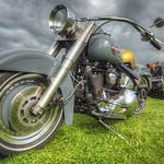 Gunmetal Harley Davidson with shiny helmet