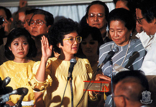 Cory Aquino takes her oath of office