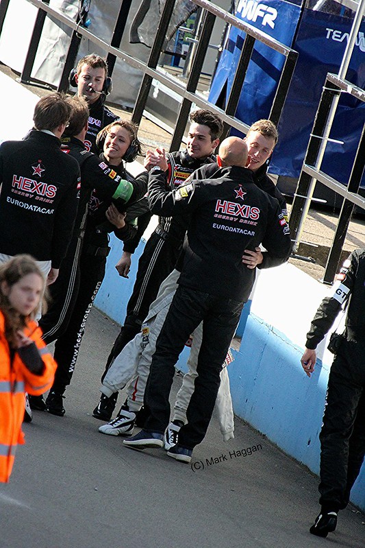 Celebrating a win in the pit lane
