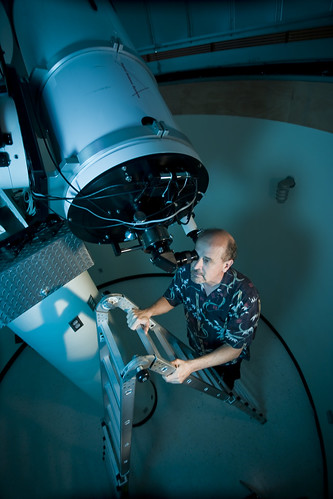 Researcher Looking Through Telescope