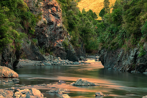 Rocky Gorge by Gary Lawford Martin, Under sunset hue, the Pohangina River winds through the rocky outcrop gorges of the Ruahine Ranges f